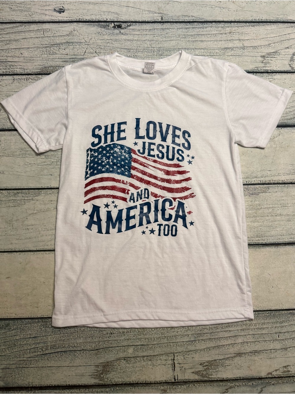 She loves Jesus and America too white flag short sleeve shirt. S
